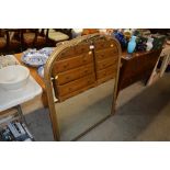 A large gilt framed over mantle mirror