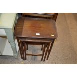 A nest of three mahogany occasional tables