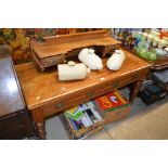 A late Victorian mahogany dressing table raised on