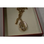 A 9 carat gold locket and chain