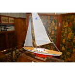 A model pond yacht on stand
