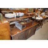 A late Victorian carved oak side board/ buffet