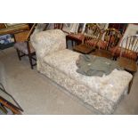 A floral upholstered day bed with lift up top