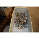 A box of metal toy soldiers