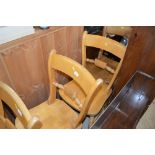 A set of three beech bar back kitchen chairs and o