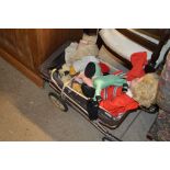 A doll's pram and contents