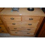 A late 19th Century stripped pine chest, fitted tw