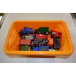 A box of die cast model vehicles