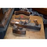 A wooden stationery rack with two old wooden worki