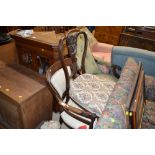 An Edwardian mahogany framed nursing chair and a m