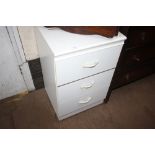 A Melomine three drawer chest