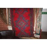 An approx 7'10" x 3'2" Turkish rug