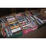 Three boxes of mostly DVDs