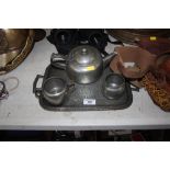 A pewter tea set and tray