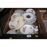 A box containing various decorative tea and dinner