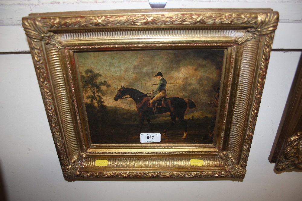 An ornate gilt framed Oleograph study of a race ho