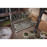 An ornate metal garden bench