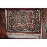 An approx 5'4" x 3'9" Eastern patterned rug