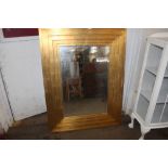 A large gilt frame mirror