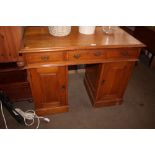 An Edwardian knee hole desk