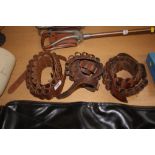 Three brown leather cartridge belts