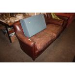 A brown leather two seater settee