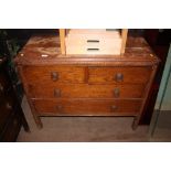 An oak chest fitted two short over two long drawer