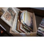 A box of various pictures; prints and trays