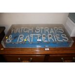 A "Watch Straps and Batteries" neon sign, sold as collector's item