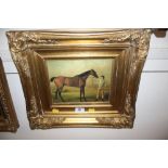 An ornate gilt framed Oleograph study of a race ho