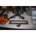 A wrought iron chandelier and an iron bracket