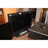 A Sony Bravia flat screen television with remote c