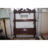 A set of mahogany wall shelves fitted two drawers