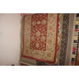 An approx 5" x 2'8" floral patterned rug