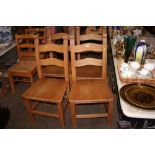 A set of four beech dining chairs