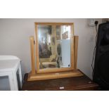 A light oak frame swing dressing table mirror