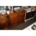 A continental style oak side cupboard fitted two d