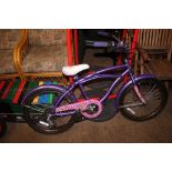 A girls purple bicycle