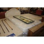 A double divan bed and Staples mattress