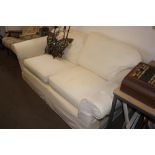 An upholstered two seater settee