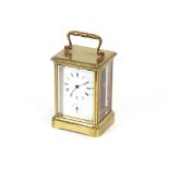 A large brass cased carriage clock, with alarm movement striking on a bell, 16cm overall