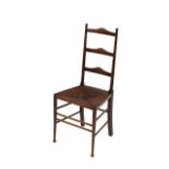 A set of nine oak and rush seated ladder back dining chairs, raised on slender stretchered supports