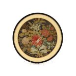A Victorian needlework picture, depicting various leaves and flowers, circular, 25cm dia.