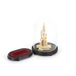 An Antique pierced and carved ivory model of a Mosque,  complete with glass dome and ebonised stand;