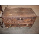 An Antique oak coffer, with square iron lock-plate and foliate carved front, single drawer to