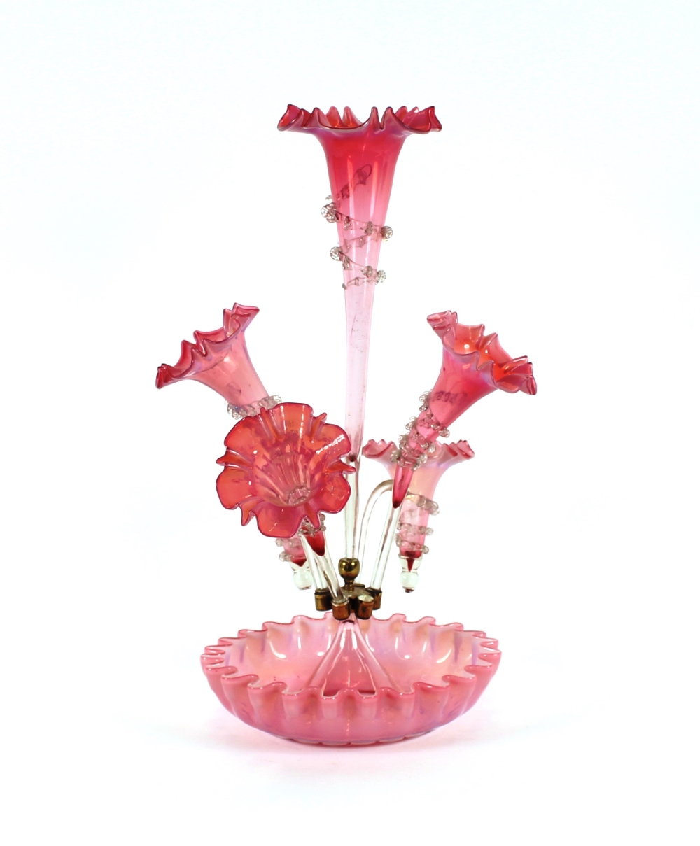 A Victorian cranberry glass table epergne, 55cm high, (some damage)