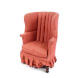 A 19th Century mahogany framed barrel back armchair, raised on turned front supports with floral