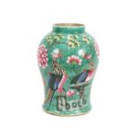 A 19th Century Chinese vase, decorated with birds amongst foliage on a green ground, (lacking