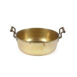 A Victorian brass preserve pan, flanked by turned handles, 36cm dia.