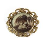 A 19th Century yellow metal mourning brooch, with a decorative panel formed from hair, scrolled